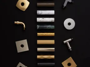 Various cylindrical and square faucet handles and parts in gold, marble, wood, and metal finishes on black.
