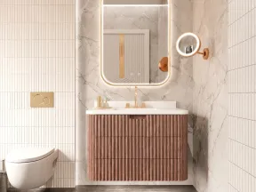 Modern bathroom with floating wooden vanity, illuminated mirror, wall-mounted toilet, and marble and tile walls.