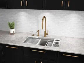 Modern kitchen sink with gold faucet, black cabinets, marble countertop, and white subway tile backsplash.
