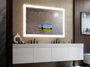 Modern bathroom with illuminated rectangular mirror, floating white vanity, marble floor, and decorative wall tiles.