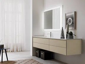 Modern minimalist bathroom with floating vanity, lit rectangular mirror, decorative vases, and sheer window curtains.