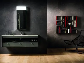 Modern bathroom with wall-mounted sink, rectangular mirror, decorative shelving, and black chair on wooden floor