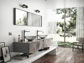 Modern bathroom with double vessel sinks, large mirror, wooden floors, and floor-to-ceiling glass window.