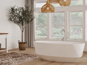 Bright modern bathroom with freestanding tub, large windows, wood flooring, wicker pendant lights, and indoor potted tree.