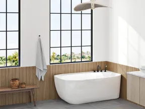 Modern bathroom with large black-framed windows, freestanding white bathtub, wooden bench, and minimalist decor.