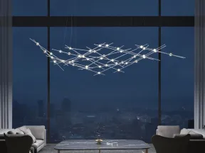 Modern living room with large windows, sleek chandelier, minimalist furniture, and cityscape night view.