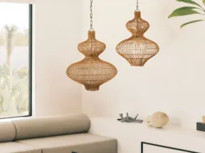 Cozy modern living room with beige sofa, glass table, and two stylish brown Irvine pendant lamps.