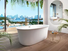 Modern bathroom with freestanding bathtub, floor-to-ceiling windows, city view, hanging plants, and stylish chandelier.