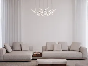 Minimalist living room with two beige sofas, modern pendant light, marble coffee table, and neutral tones.