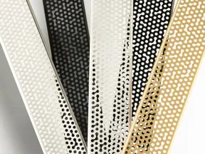 Close-up of metallic strips with perforated dot patterns in white, black, and gold colors arranged overlapping.