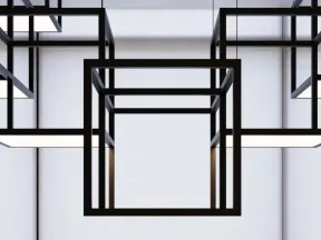 Modern black geometric cube pendant lights hanging against large white window blinds in minimalistic space.