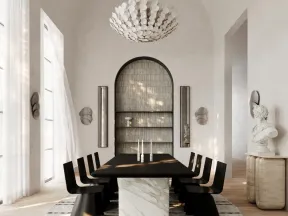 Modern dining room with black chairs, marble table base, round rug, large chandelier, and bright natural light.