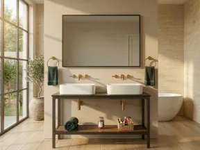 Modern bathroom with double white sinks, large mirror, gold fixtures, green towels, and natural light from floor-to-ceiling window.