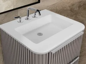Modern bathroom sink with white rectangular basin, chrome faucet, and textured vertical striped vanity cabinet.