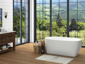Modern bathroom with freestanding tub, wood vanity, floor-to-ceiling windows showcasing lush green mountain view