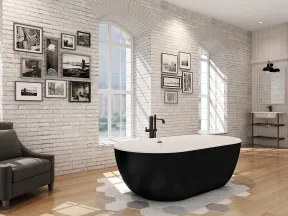 Modern bathroom with black freestanding tub, white brick walls, large arched windows, and black leather armchair.