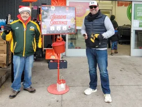 a couple of men standing next to a fire hydrant