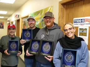 a group of people holding books