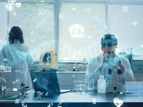 Scientists working in a laboratory using a microscope and digital technology with connected data icons overlay.