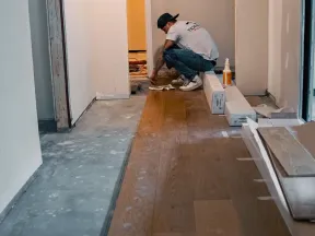 a person squatting on a floor