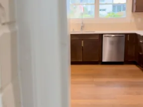 a kitchen with a wood floor