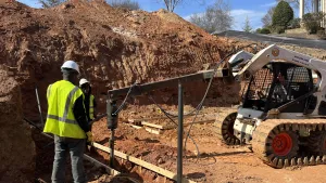 Cantsink installing helical piles at a homesite