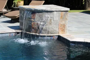 Water Feature that spills into gunite pool