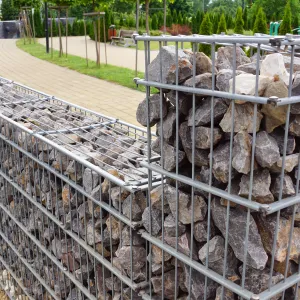 a fence with a group of statues