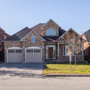 a large brick house with a garage