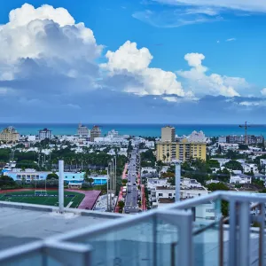 a city with a body of water in the background