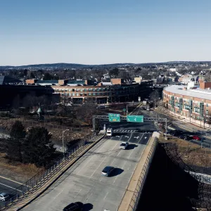 a highway with cars and buildings