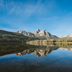a lake with mountains in the background