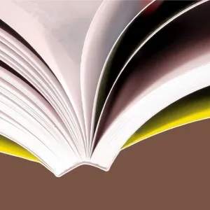 Close-up of an open softcover book bound with PUR adhesive