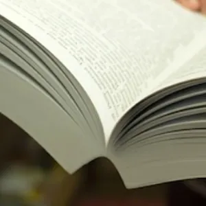 Close-up of an open perfect bound book focusing on the gutter area.
