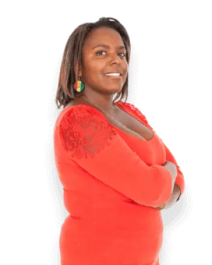 Confident woman wearing a red top with lace sleeves and colorful earrings, smiling with arms crossed.