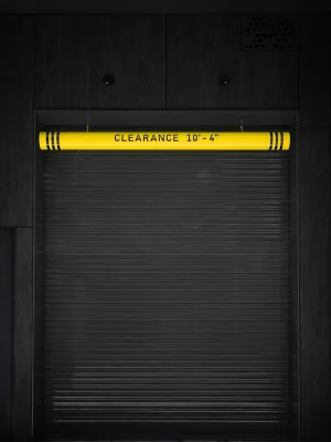 a black metal door with yellow text