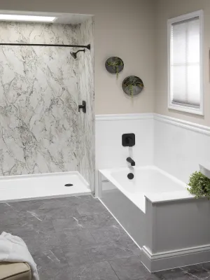 a bathroom with a tub sink and a bathtub