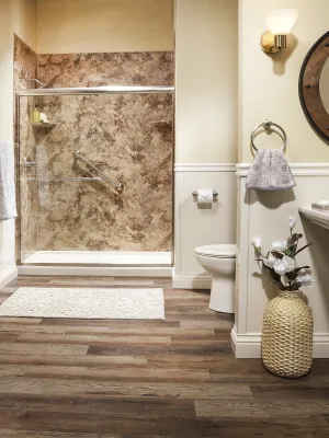 a bathroom with a sink toilet and a mirror