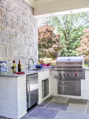 a kitchen with a brick wall