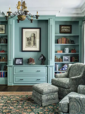 a room with a piano and bookshelves