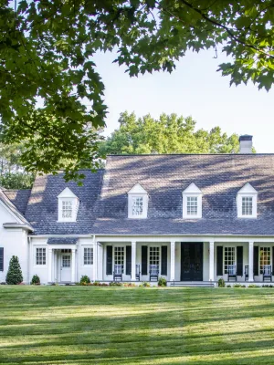 a large house with a lawn in front of it