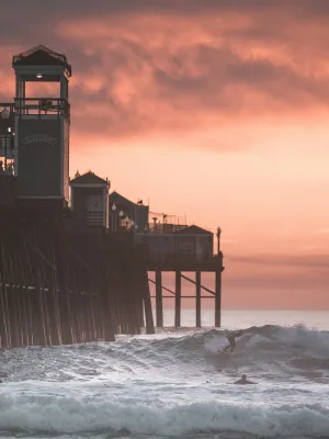 a pier with waves crashing against it