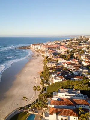 a beach with houses along it