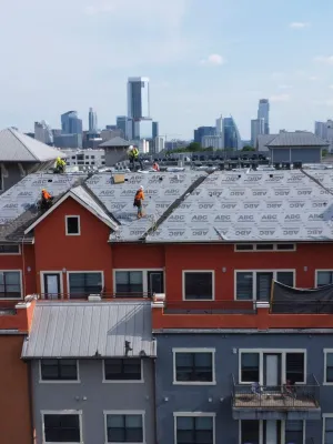 a group of buildings with snow on the roofs