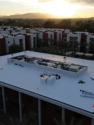 a large building with a pool in front of it