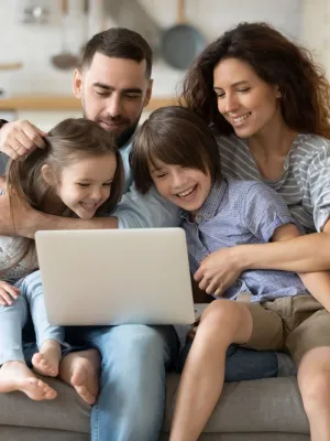 a family sitting on a couch
