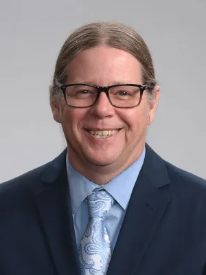 lawyer Matthew L Rappold wearing glasses and a suit