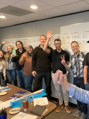 a group of people standing in a room