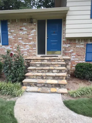 a brick house with blue doors