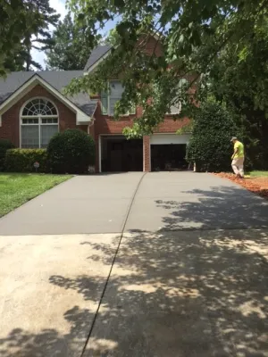 a man standing in front of a house